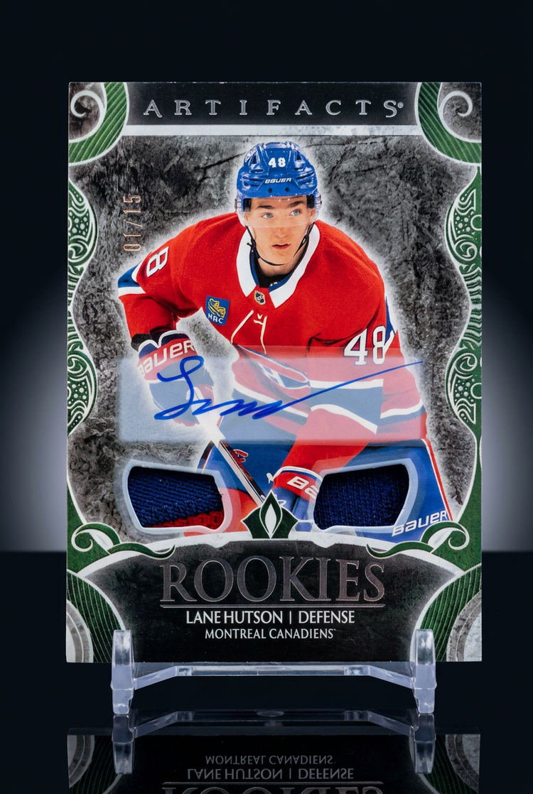 Lane Hutson Artifacts rookie patch autograph card, numbered 01/15, on a display stand